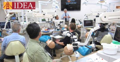 A group of dentists participating in a hands-on training session